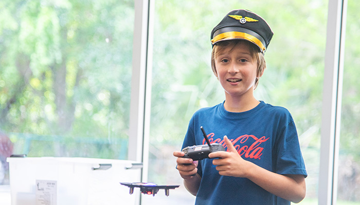 boy flying drone